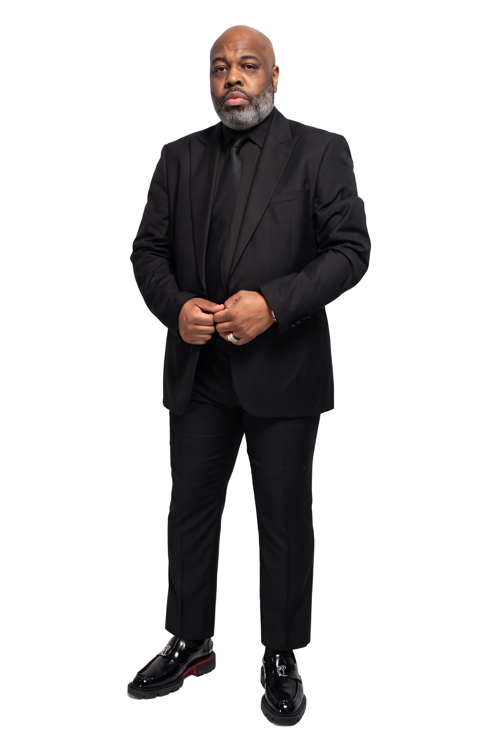 Dr. A. Ray Rouson Jr. standing in a black suit